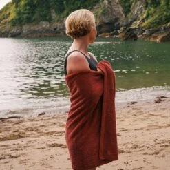 Mineral Red Organic Cotton Towels -Home Luxury Store Piglet in Bed Organic Cotton Towel Mineral Red Lifestyle 1 d008236a 5b9a 494a 8846 044d08ea7b06