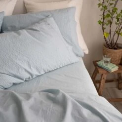 Sky Blue Seersucker Cotton Pillowcases (Pair) -Home Luxury Store Piglet in Bed Seersucker Cotton Bedding Sky Blue Lifestyle 9 7bc1e88d 4cfc 42db 80e2 5f94be65ffcc